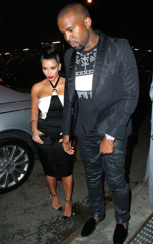 JustEnvee: Kanye wearing Givenchy Cross Print T-shirt and Kim Kardashian Christian Un Bout Pumps