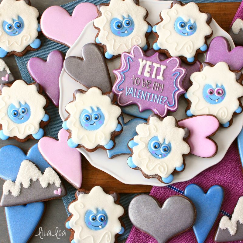 Yeti decorated sugar cookies in blue, gray, and purple