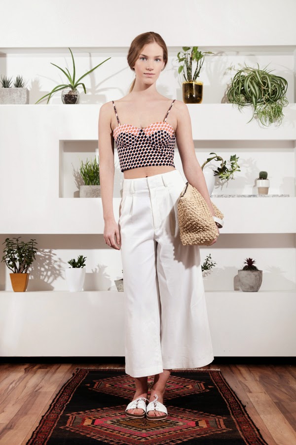 One of a Few patterned crop top bustier and white gaucho pants