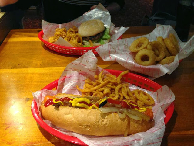 our meal which consisted of burger and chips for sean, hot dog and chips for me, and a portion of onion rings to share