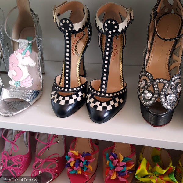 shoe shelves with Charlotte Olympia black checkered t-bar shoes sitting centre