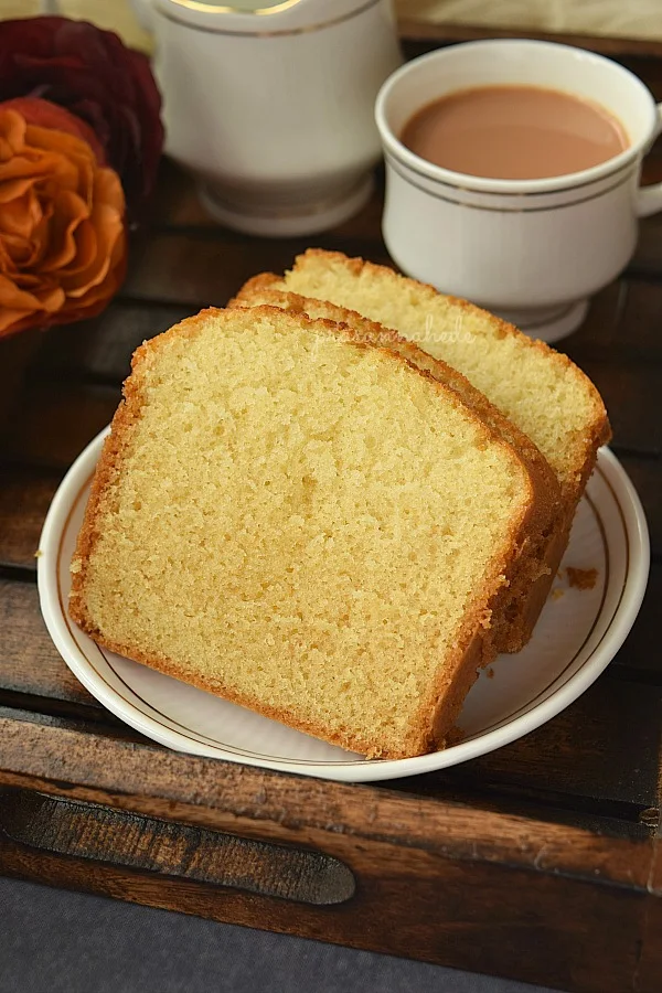 Delicious soft Tea Cake served on a tray with a cup of tea