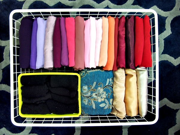 Innovative clutter free hijab storage idea. Made from plastic tubes.