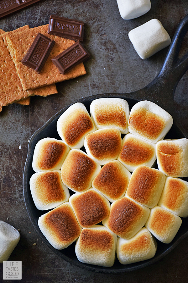 Skillet S'mores Dip | by Life Tastes Good. This indoor s'mores recipe is an easy recipe with just 4 ingredients and ready in only 5 minutes. No campfire needed! Great for a quick snack, dessert, or party appetizer. #LTGrecipes