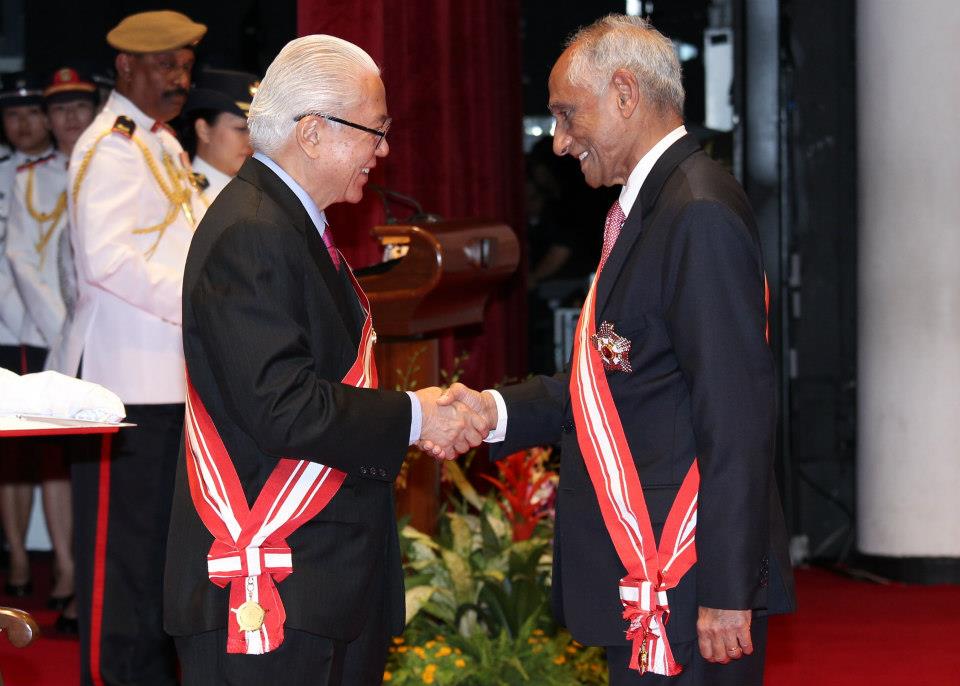 President Tony Tan conferring J. Y. Pillay with a National Day Award. Source