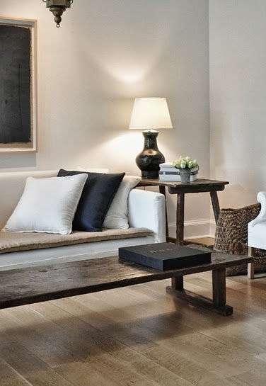 white sofa, light wood floors, old table, wabi sabi