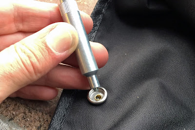Use a press stud tool to fit the buttons to the eyelets