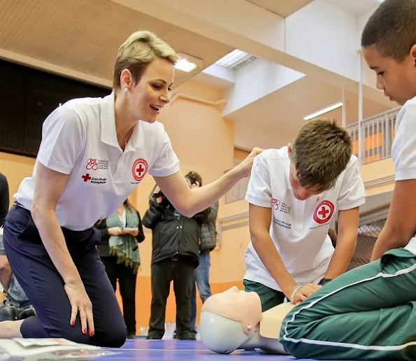 Princess Charlene of Monaco taught water safety and life saving first aid techniques after facing drowning danger to young rugby players who have come to Monaco from South Africa