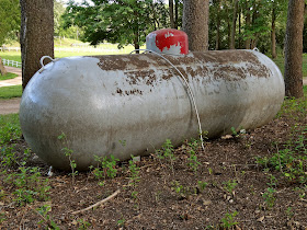 Big , mysterious, rural propane tank.