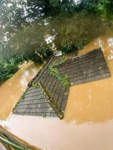 Tiled house submerging in flood water, Kerala floods