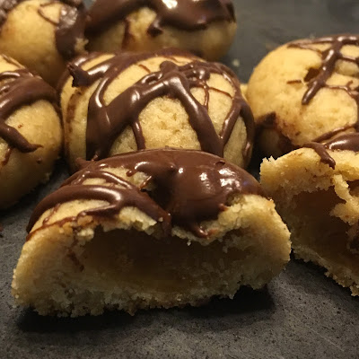 brown sugar cookie, drizzled with chocolate, and cut in half to reveal a hollow center