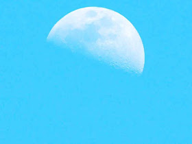 half moon, first quarter,late afternoon, blue skies
