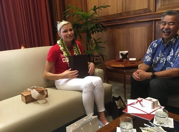 Princess Charlene of Monaco visited Honolulu, Hawaii met Governor David Idge. She wore red shirt and white pants