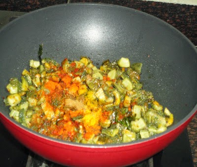 Add the masala - preparing karlaychi peeth perun bhaji recipe