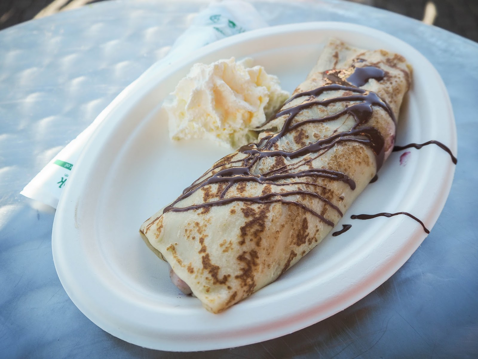 Crepe with chocolate sauce and whipped cream