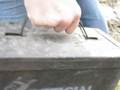 A picture of Jennifer Wirawan's hand carrying a geocache.
