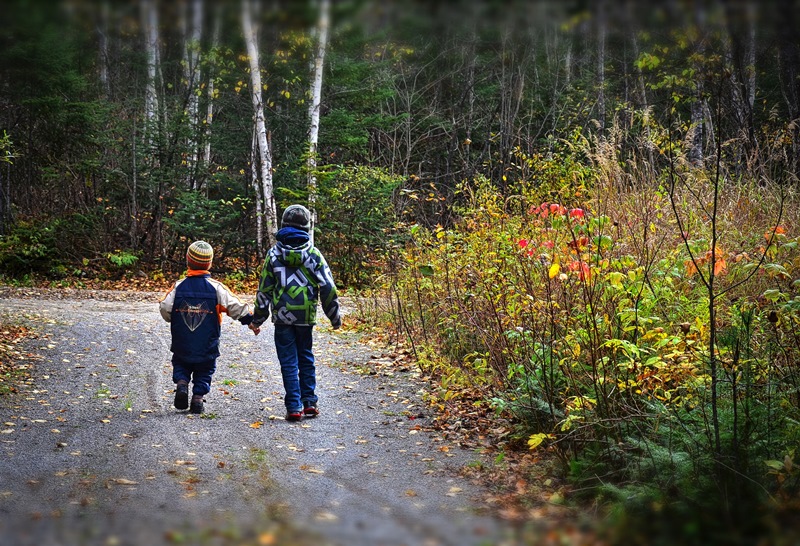 namc montessori mixed age group benefits. boys walking holding hands 