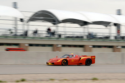 Red Ferrari FXX track racing brakes heated burning fire