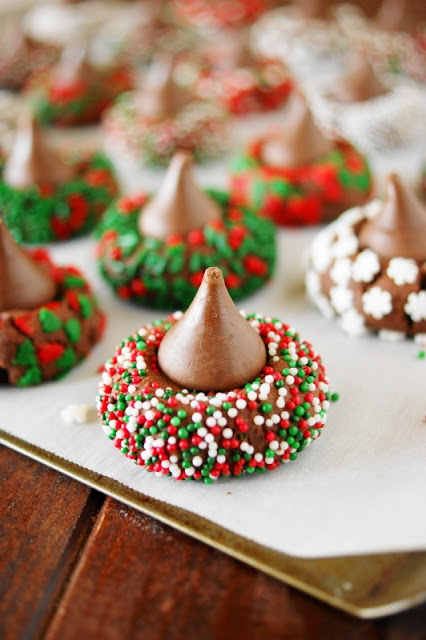 Christmas Chocolate Kiss Cookies ~ Spread some holiday cheer with these adorable little treats! A fun cookie project for kids & grown-ups alike.  www.thekitchenismyplayground.com