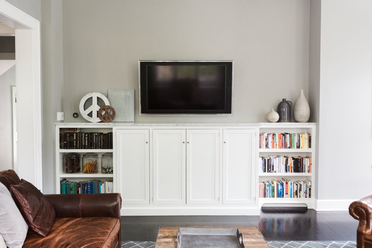 White built-ins in a modern farmhouse great room on Hello Lovely Studio