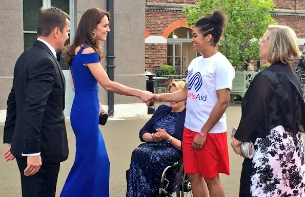 Kate Middleton attended the TeamSportsAid 40th anniversary dinner at Kensington Palace. Kate Middleton wore Roland Mouret Nansen Crepe Dress, PRADA Clutch