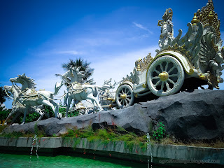 Back Side View Of Krishna's Chariot Statue In The Middle Of A Garden Pond At Tangguwisia Village, North Bali, Indonesia
