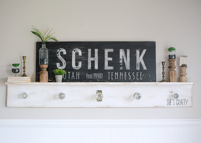 Use vinyl as a stencil for wooden signs and faux plants to decorate your mantel for winter
