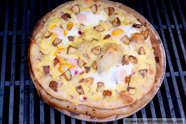 This grilled pizza recipe combines fresh eggs with roasted potatoes and a thick layer of creamy gouda cheese.