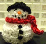 http://www.ravelry.com/patterns/library/snowman-chocolate-cover-decoration