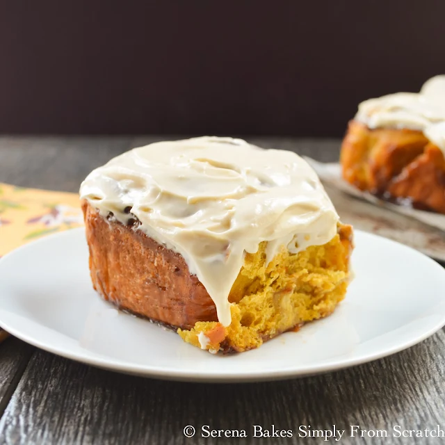 Pumpkin Cinnamon Rolls With Maple Cream Cheese Frosting are so good that even if you normally just eat the center you'll enjoy the whole roll! serenabakessimplyfromscratch.com