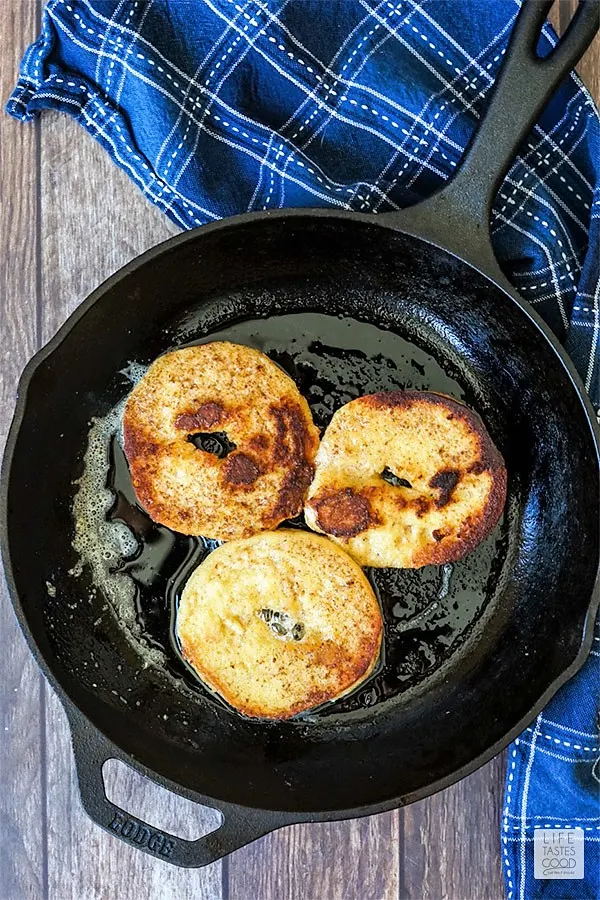 Frying up French Toast Bagels in a cast iron skillet for breakfast