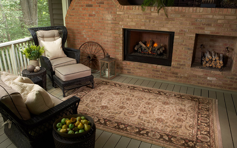 Beautiful plank flooring and area rug in this three season room