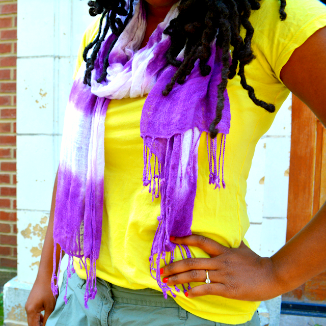 neon tee worn with a tie dye scarf