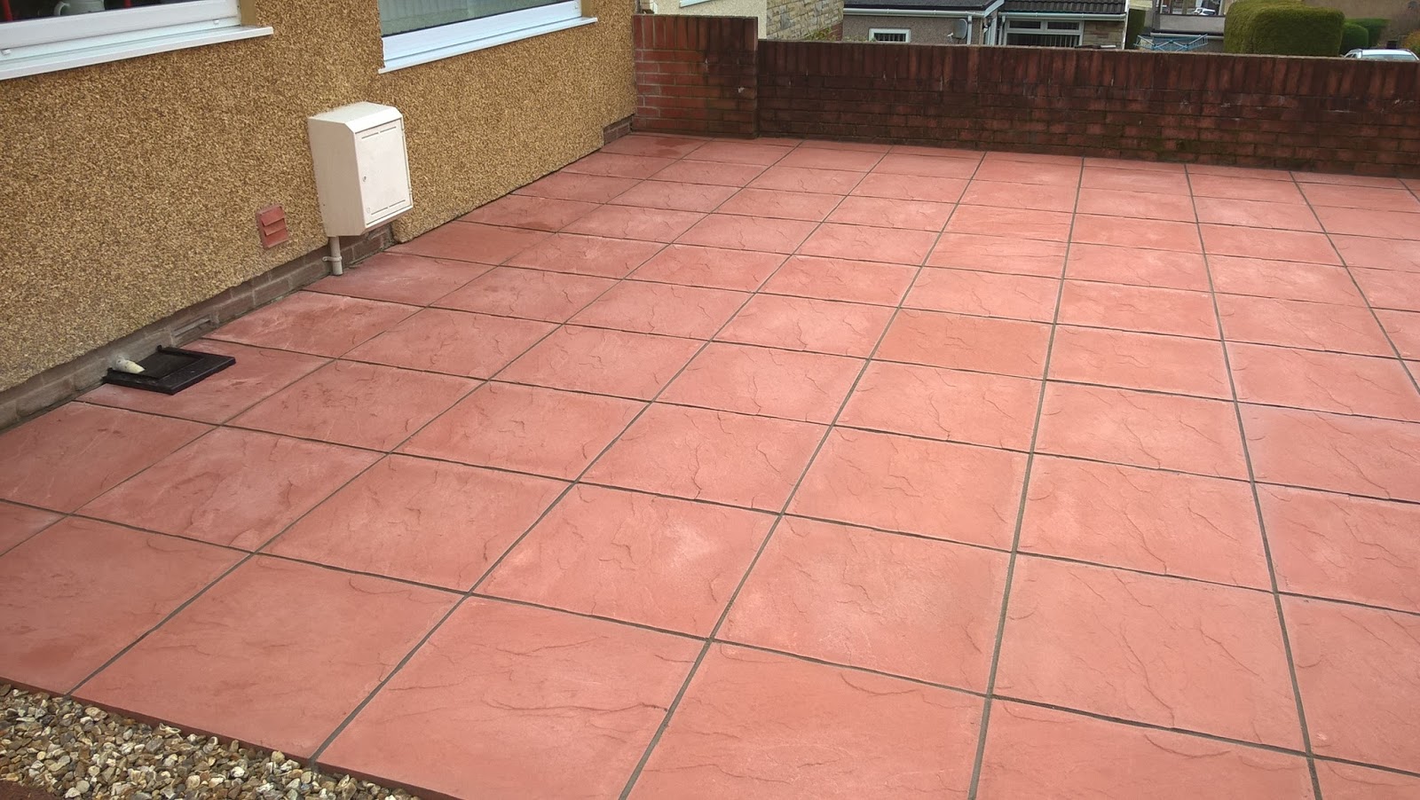 CWM LLYNFI BRICKLAYING : Red concrete paving slabs 600mm x 600mm with
