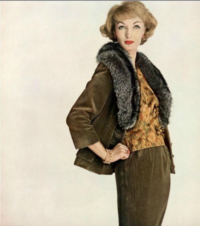 Evelyn Tripp in mushroom-colored corduroy suit with raccoon collar  worn with amber floral-print satin blouse by Jo Copeland of Patullo.  Jewelry by Verdura,. Photo by Karen Radkai, Vogue, October 15, 1958