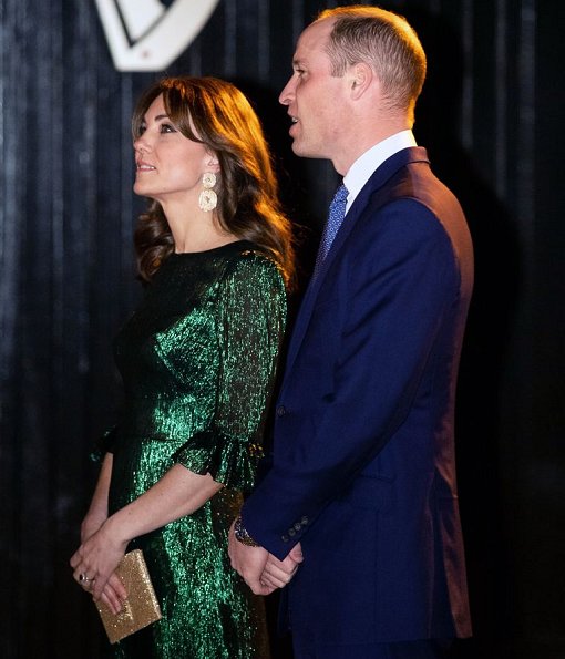 Kate Middleton wore The Vampire's Wife Falconetti emerald midi dress, Brora gold charm earrings. Meghan Markle