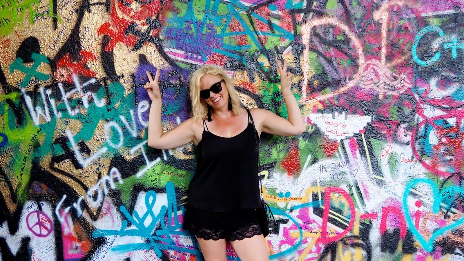 Ashley Turner with graphiti wall