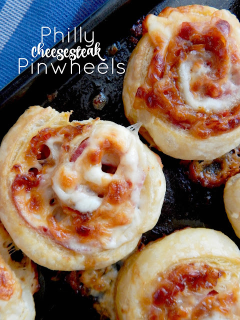 Philly Cheesteak Pinwheels...roast beef, melty cheese, peppers, onions and a sweet glaze all wrapped up in buttery puff pastry.  An easy party appetizer! (sweetandsavoryfood.com)