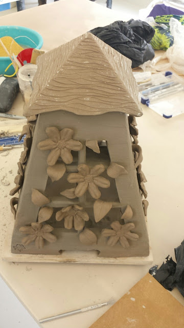 Pottery lantern with clematis design in progress by Lily L.