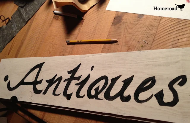 Antiques sign on reclaimed wood