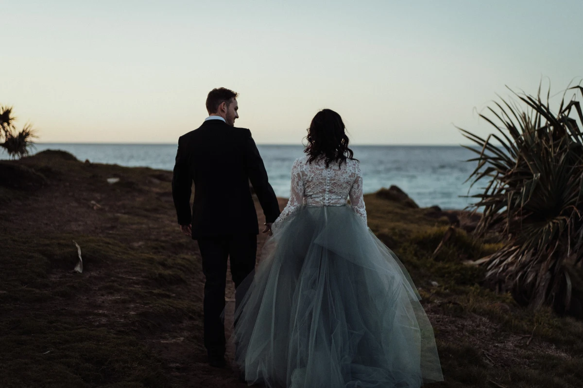 white parrot film and photography beach wedding elopement australian designer dark moody bridal fingal head