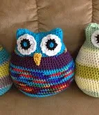http://www.ravelry.com/patterns/library/owl-pillows-in-two-sizes