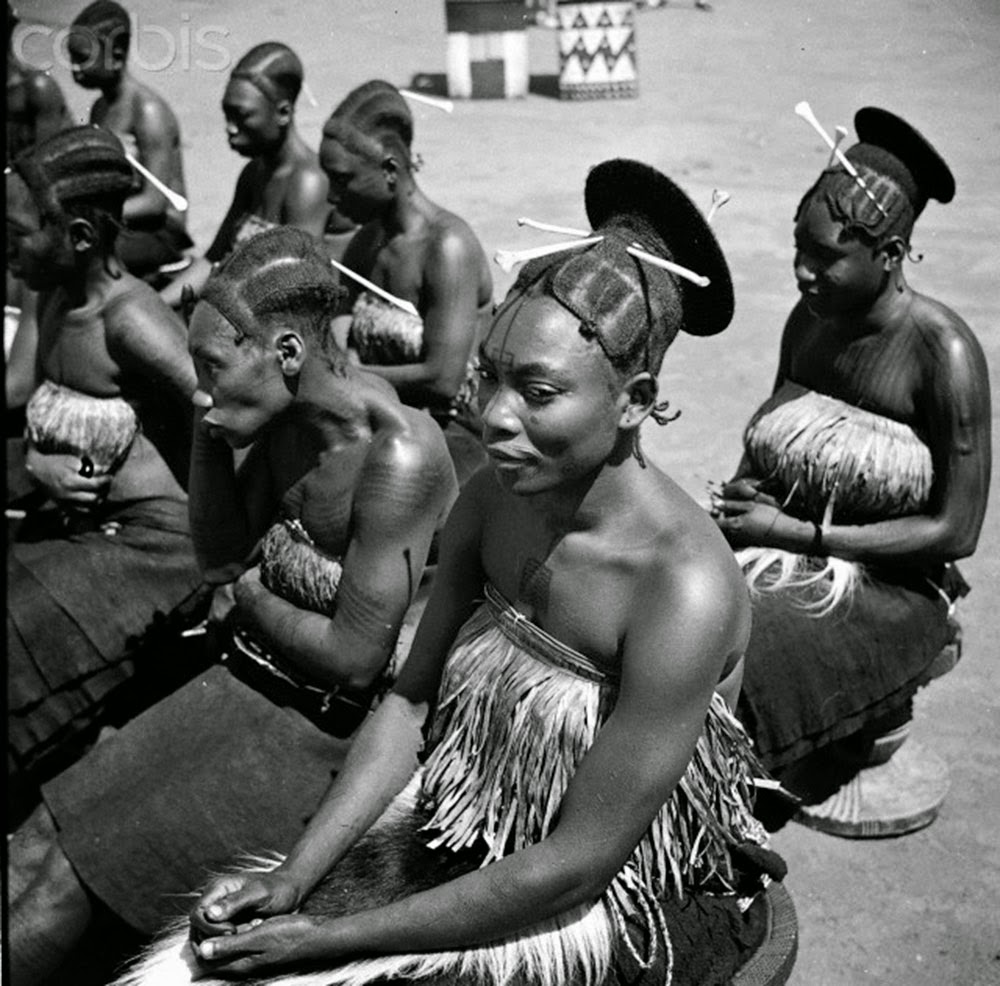 A distinctive coiffure was used to emphasize their artificially elongated heads.