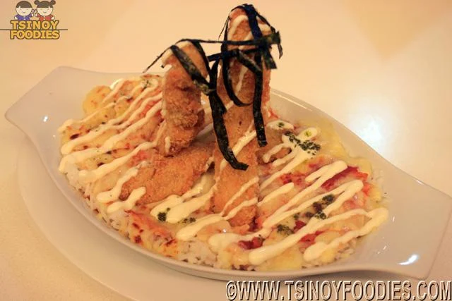 chicken strips on baked tomato rice