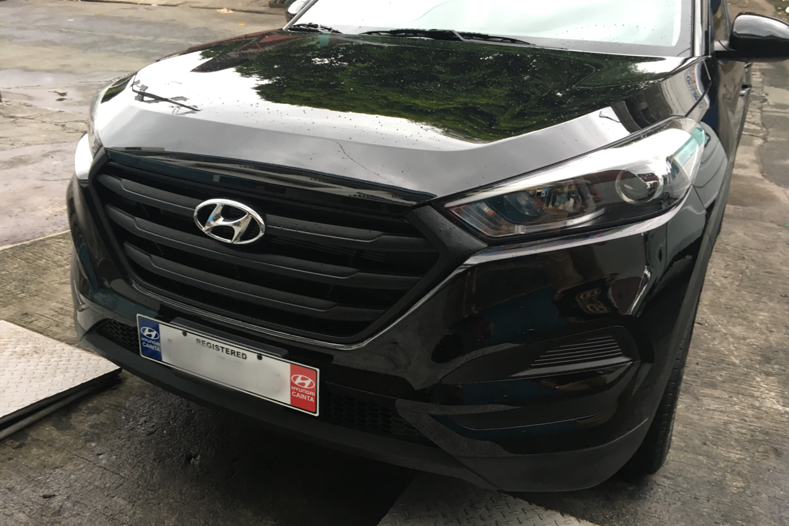 Road to stealthy look Matte black vinyl wrap on Hyundai Tucson stock