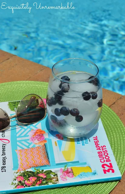 Blueberry water in glass by pool