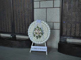 wreath with the words "IN MEMORY OF THE FALLEN"