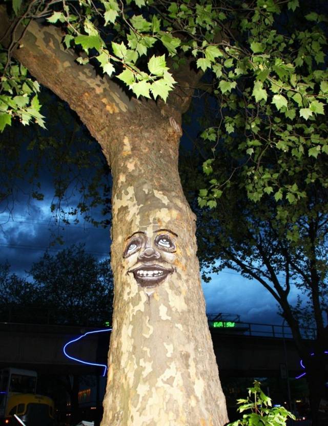 Painting eyes, faces and grimaces on the trees, by ornamenting and dressing them we emphasize our close and unique connection with nature.