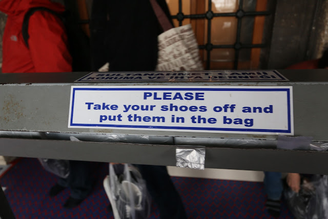 Remove and keep your shoes in a plastic bag before entering Blue Mosque at Sultanahmet Square in Istanbul, Turkey Remove and keep your shoes in a plastic bag before entering Blue Mosque at Sultanahmet Square in Istanbul, Turkey