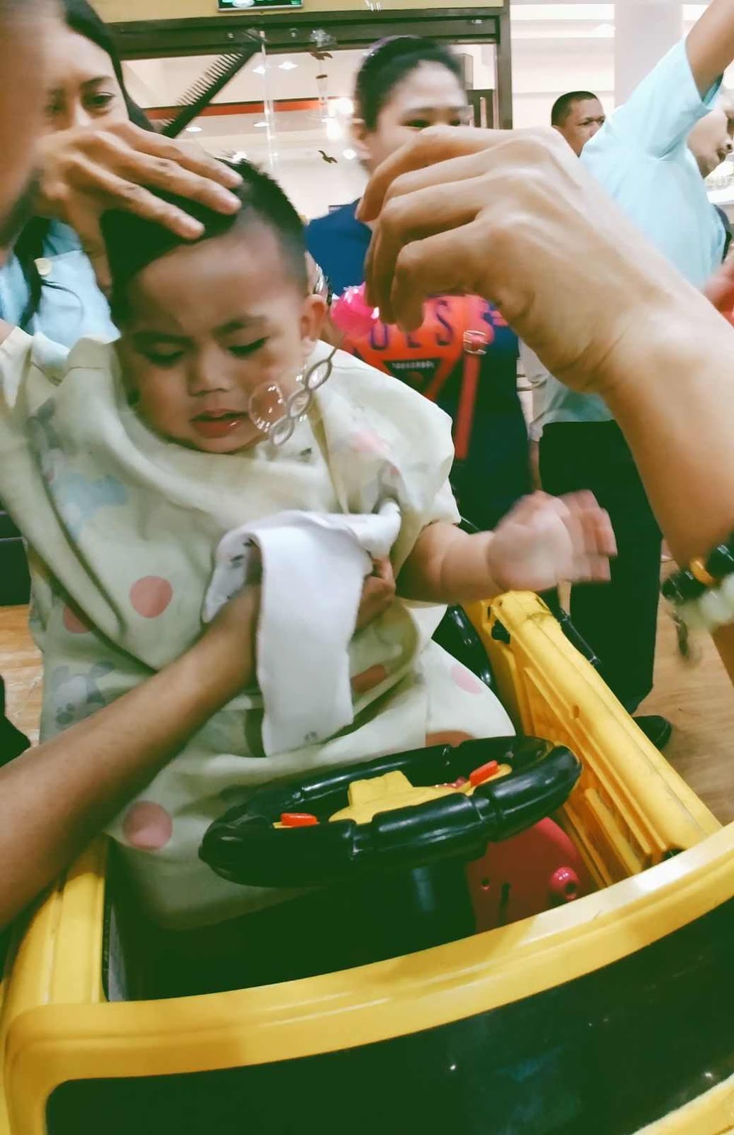 Miguel a bit agitated during his first haircut at Cuts 4 Tots